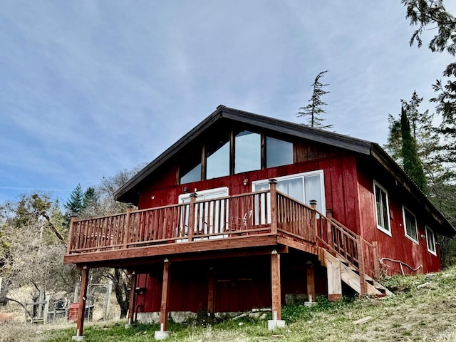 back of house featuring a wooden deck