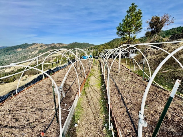 exterior space with a mountain view and a rural view