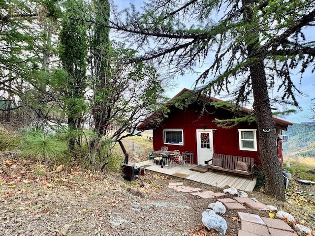 view of front of property with a wooden deck