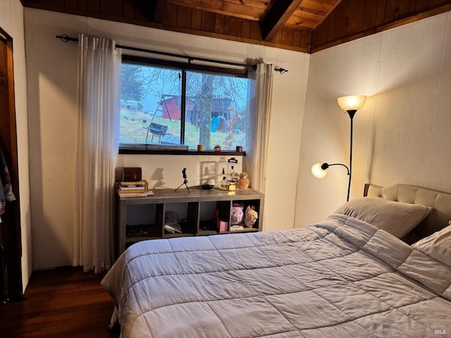 bedroom with vaulted ceiling, wood-type flooring, wooden ceiling, and wood walls