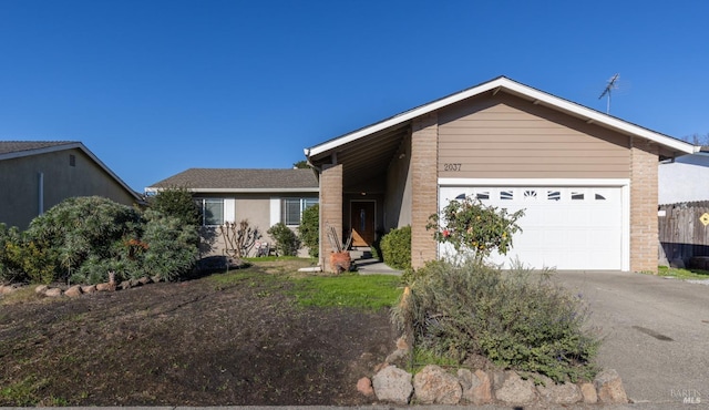 ranch-style home with a garage