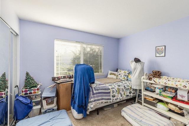 bedroom with carpet flooring and a closet