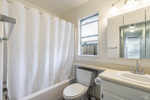 full bathroom with visible vents, shower / tub combo, vanity, and toilet