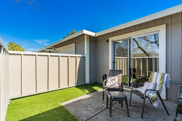 view of patio / terrace featuring fence