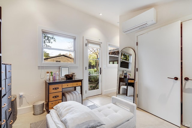 sitting room featuring recessed lighting and a wall mounted AC