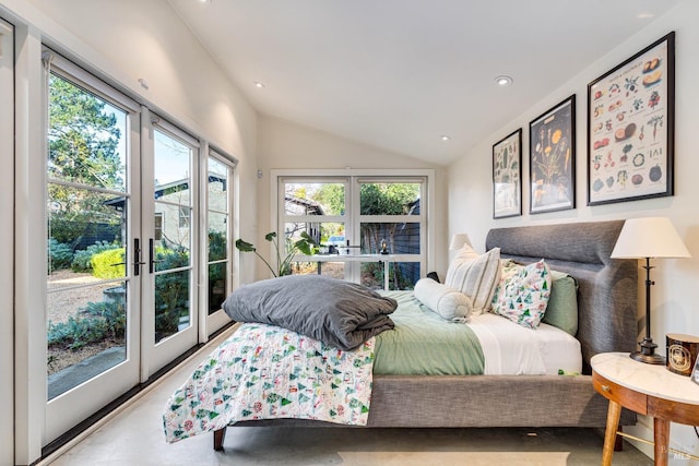 bedroom featuring lofted ceiling, french doors, concrete floors, and recessed lighting