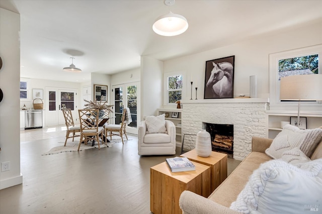 living area with a fireplace and wood finished floors