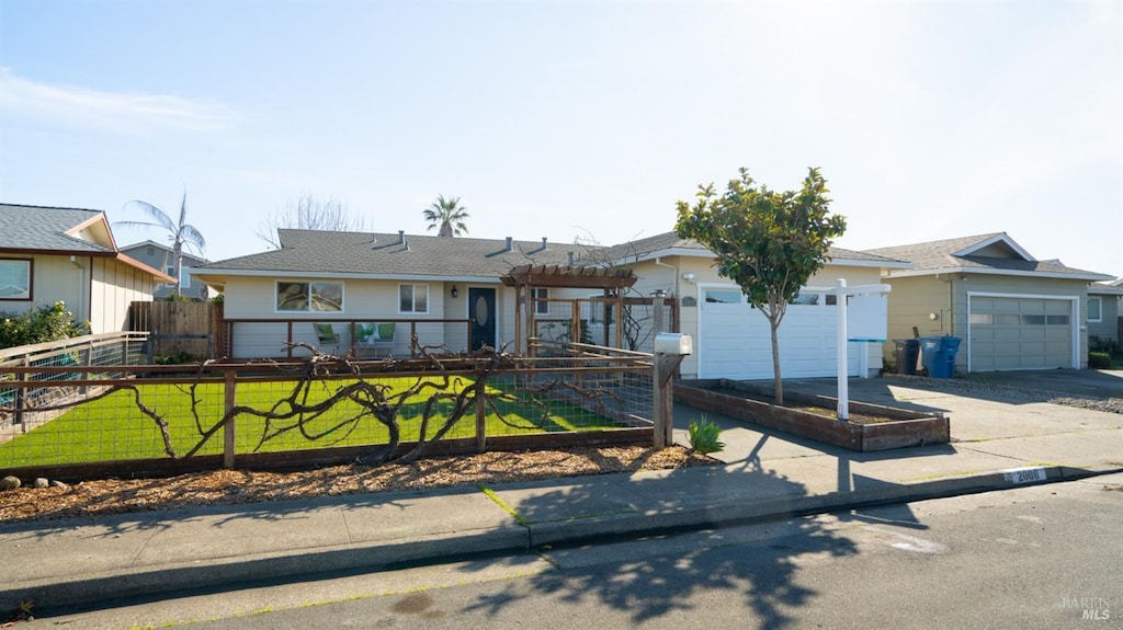 ranch-style home featuring a front yard and a garage