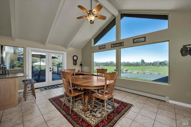 tiled dining space with a baseboard radiator, beamed ceiling, french doors, a water view, and ceiling fan