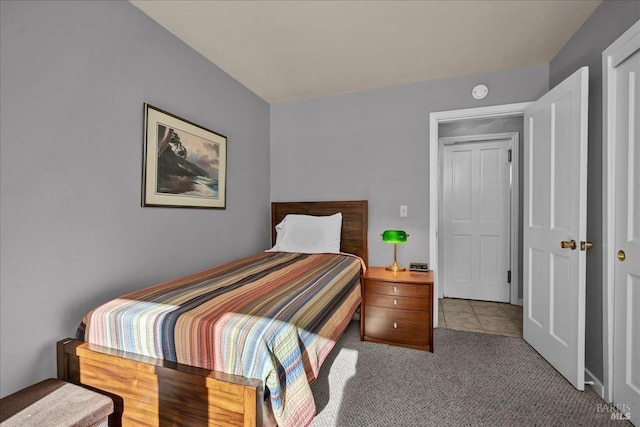 bedroom with light colored carpet