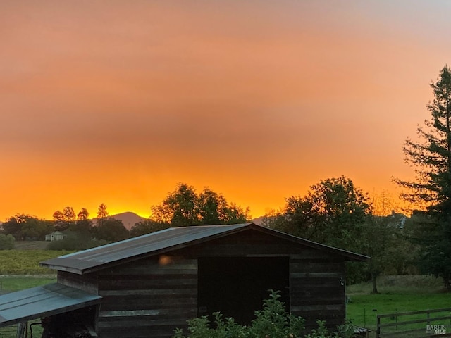 view of outdoor structure at dusk