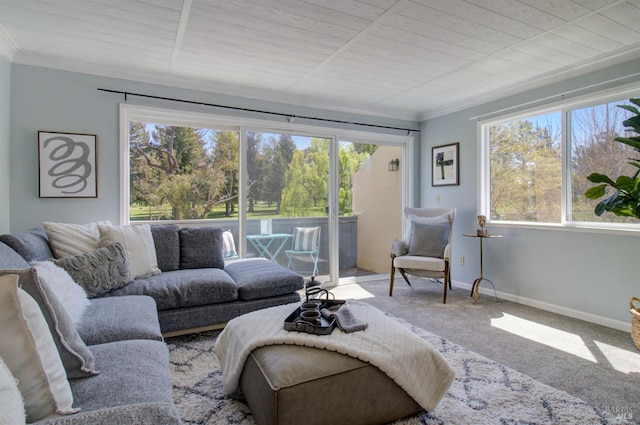 carpeted living room with ornamental molding