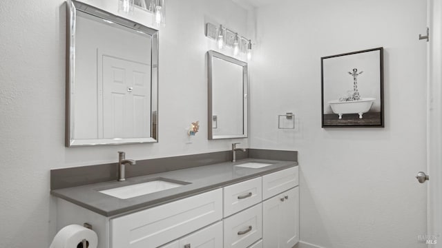 bathroom with double vanity and a sink