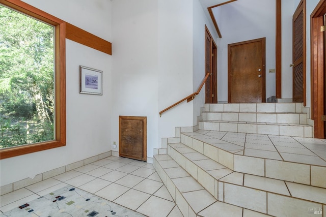 stairs with tile patterned flooring