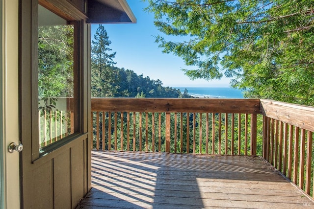 wooden deck featuring a water view