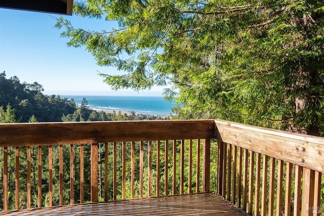 wooden deck featuring a water view