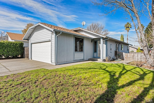 single story home with a garage and a front lawn