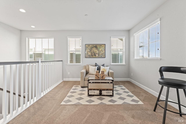 living area featuring recessed lighting, carpet, and baseboards