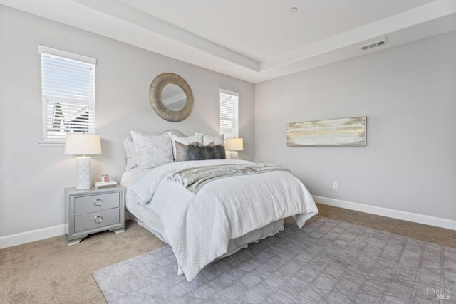 bedroom with visible vents, baseboards, and carpet floors