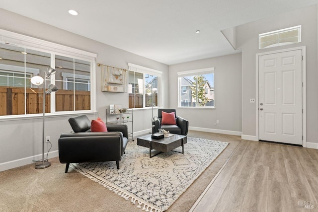 living area featuring wood finished floors, recessed lighting, and baseboards