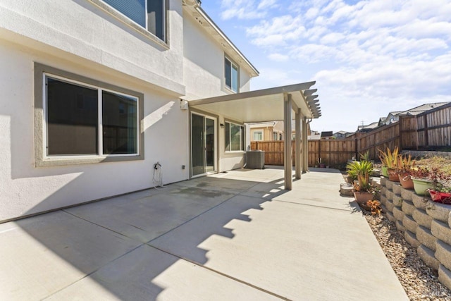 view of patio featuring fence