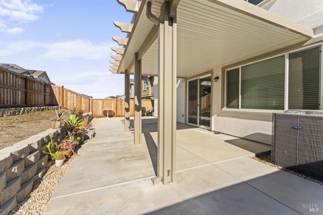 view of patio featuring central AC, a fenced backyard, and a pergola