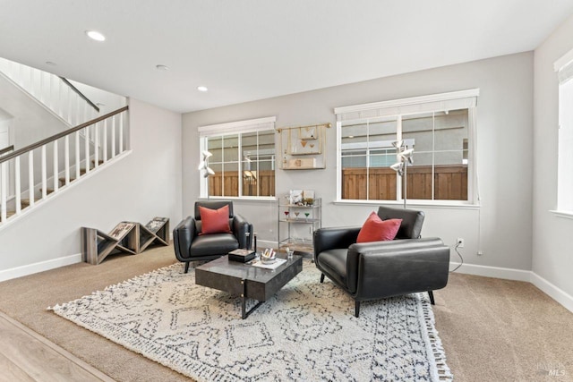 carpeted living room featuring stairway, recessed lighting, and baseboards