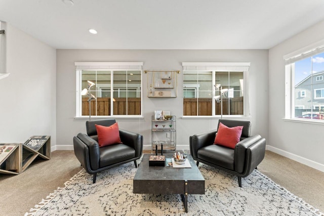 carpeted living room featuring recessed lighting and baseboards