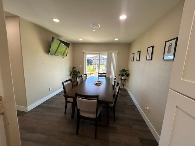 dining area with dark hardwood / wood-style flooring