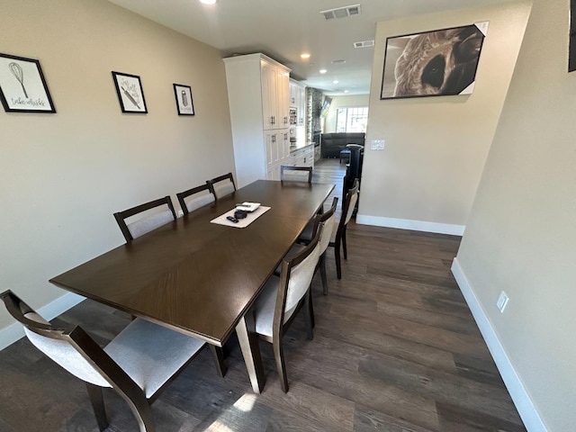 dining space featuring dark hardwood / wood-style flooring