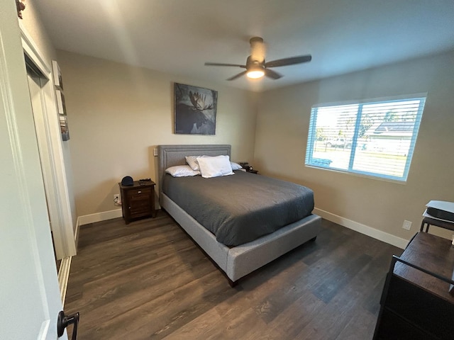 bedroom featuring ceiling fan and dark hardwood / wood-style flooring