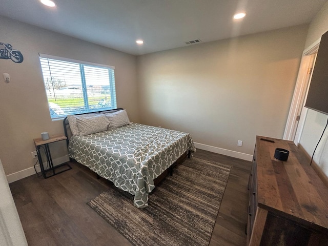 bedroom featuring dark hardwood / wood-style floors