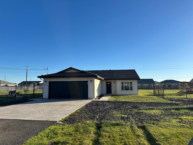 single story home featuring a garage and a front yard