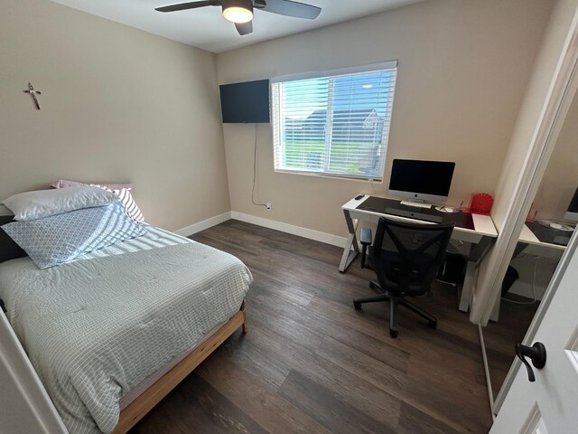 bedroom featuring dark hardwood / wood-style flooring and ceiling fan