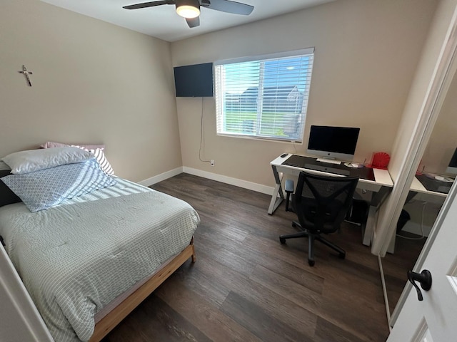 bedroom with dark wood-type flooring and ceiling fan