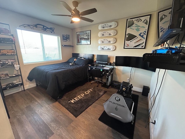 bedroom featuring dark hardwood / wood-style floors and ceiling fan