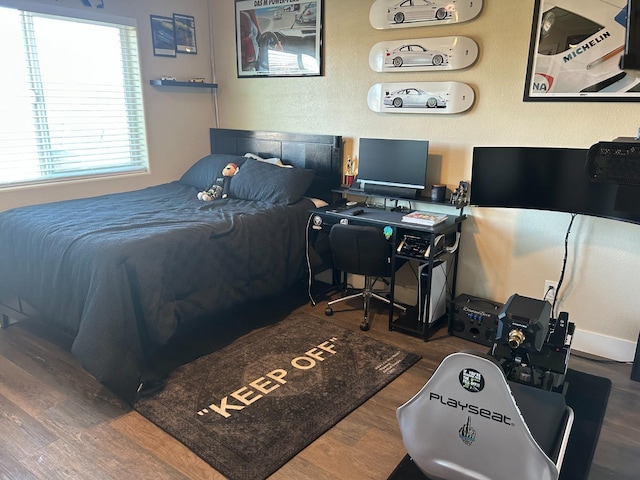 bedroom with wood-type flooring