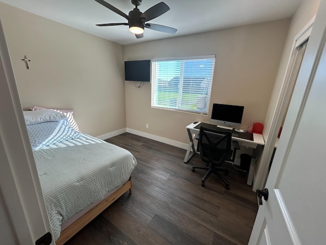 bedroom with dark wood-type flooring and ceiling fan