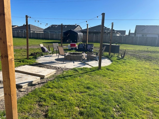 view of yard with a patio area and a fire pit