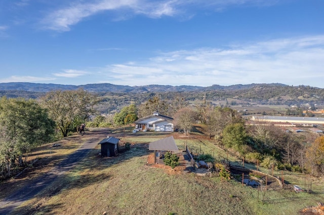 aerial view with a mountain view and a rural view