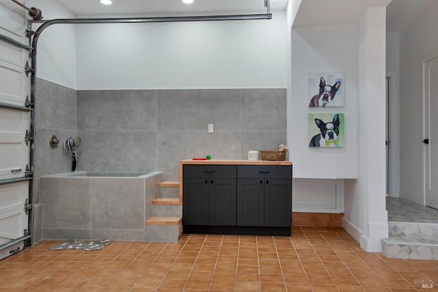 bathroom featuring tile patterned floors and walk in shower