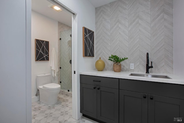 bathroom featuring toilet, walk in shower, and vanity