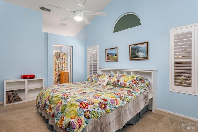 bedroom with vaulted ceiling, light carpet, and ceiling fan