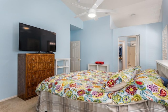 carpeted bedroom featuring lofted ceiling and ceiling fan