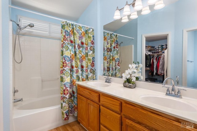 bathroom with vanity, hardwood / wood-style floors, and shower / bath combo with shower curtain