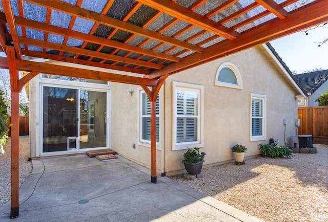 view of patio / terrace featuring a pergola and central AC