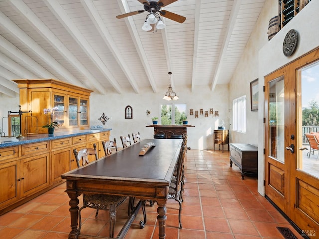 dining area featuring french doors, visible vents, beamed ceiling, and light tile patterned floors