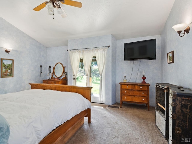 bedroom featuring access to outside, carpet, and a ceiling fan