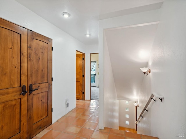 hallway featuring light tile patterned floors