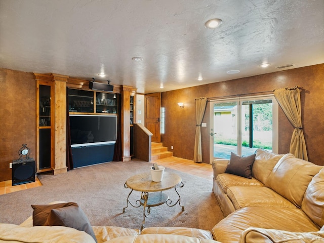 living room with light carpet, stairs, and visible vents